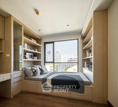 Cozy bedroom with built-in wooden shelves and city view window, perfect for urban living.