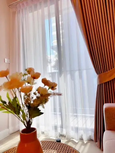 Charming living room with elegant curtains and natural light