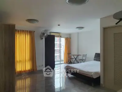 Spacious studio apartment with modern furnishings and natural light