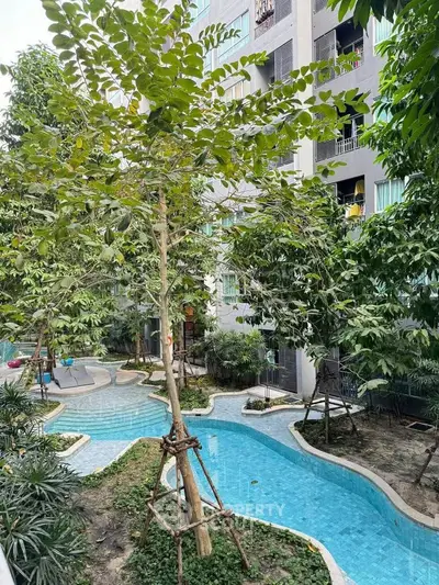 Serene garden view with winding pool in modern residential complex
