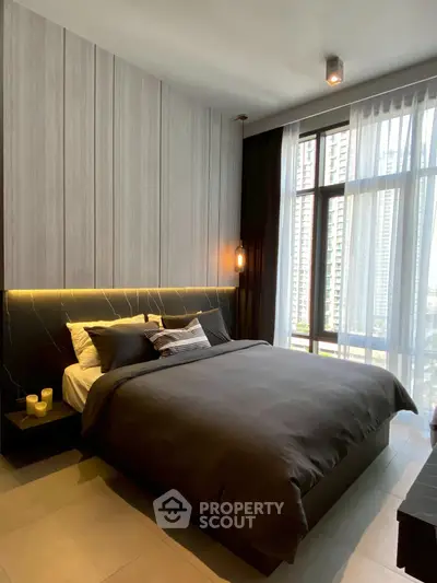 Luxurious modern bedroom with floor-to-ceiling windows and elegant decor.