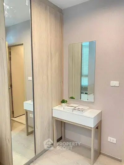 Modern bedroom corner with sleek wardrobe and minimalist vanity table