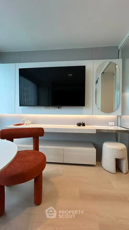 Modern living room with sleek TV setup and stylish furniture
