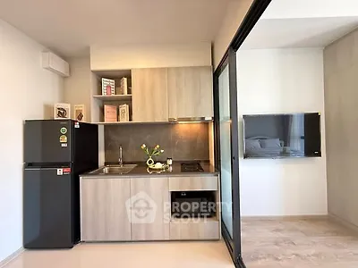 Modern compact kitchen with sleek appliances and open layout