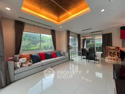 Spacious modern living room with elegant lighting and large windows