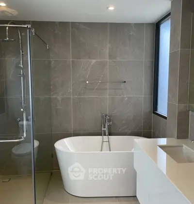 Modern bathroom with freestanding bathtub and sleek design