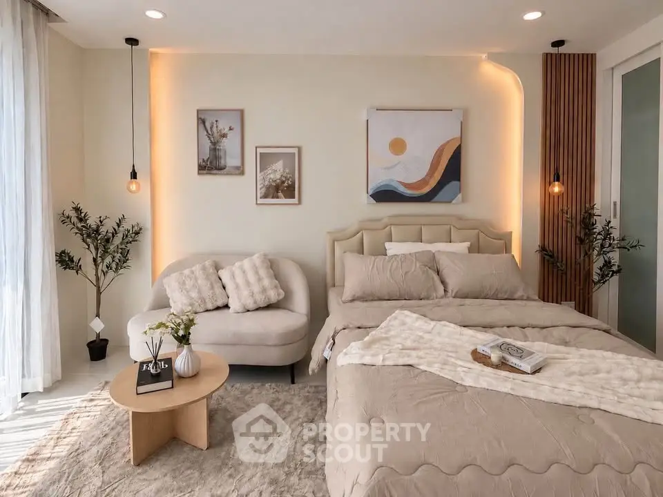 Elegant bedroom with modern decor and cozy seating area