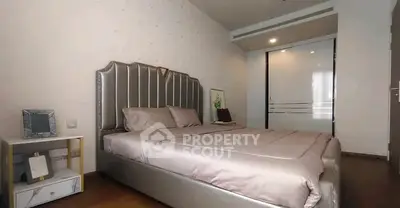 Luxurious bedroom with elegant bed and modern decor in a stylish apartment.