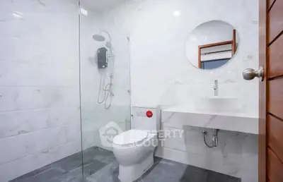 Modern bathroom with sleek design and glass shower enclosure