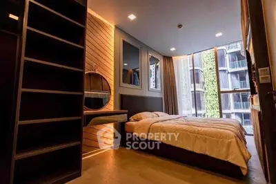 Modern bedroom with large windows and stylish decor in urban apartment