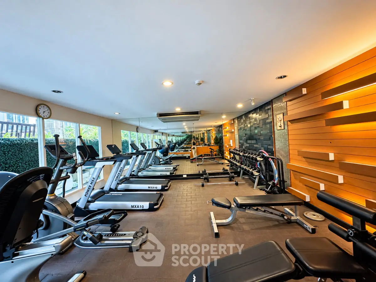 Modern gym with state-of-the-art equipment and stylish interior design, perfect for fitness enthusiasts.