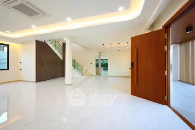 Spacious modern living room with elegant lighting and open layout