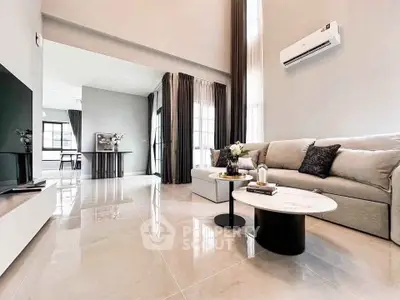 Spacious modern living room with elegant decor and natural light