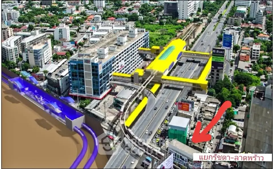 Aerial view of urban development with highlighted transit infrastructure and cityscape.