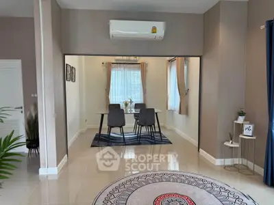 Modern dining area with air conditioning and stylish decor in a contemporary home.