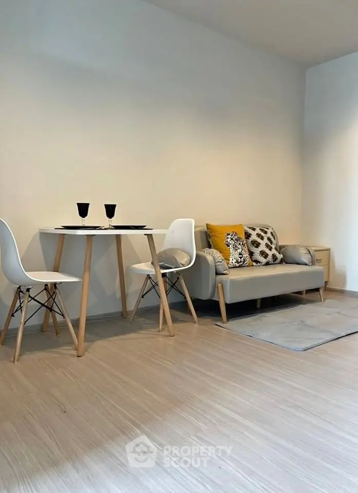 Modern living room with cozy sofa and stylish dining area