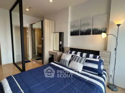 Modern bedroom with stylish decor and mirrored wardrobe