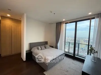 Luxurious bedroom with stunning city view and modern decor