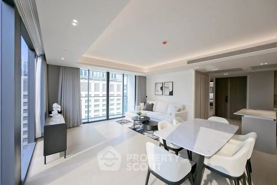 Luxurious modern living room with open layout and large windows offering city views.