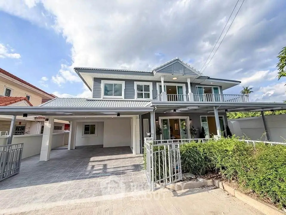 Stunning two-story house with spacious driveway and lush greenery, perfect for family living.