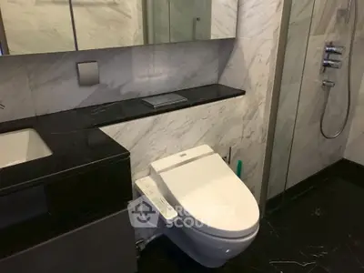 Luxurious modern bathroom with sleek marble finishes and high-end fixtures.