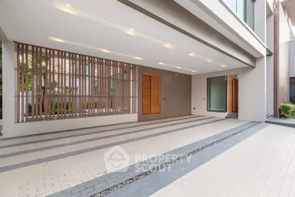 Modern building entrance with sleek design and spacious layout.