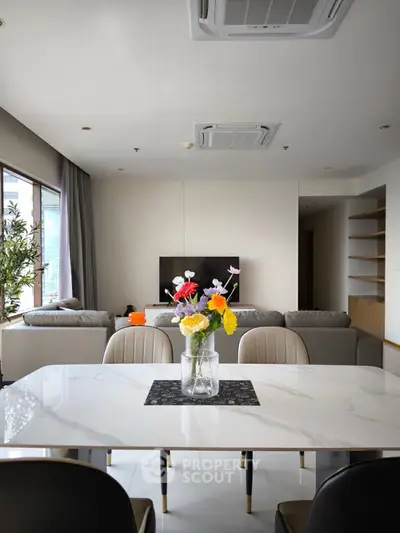 Modern living room with elegant dining area and stylish decor