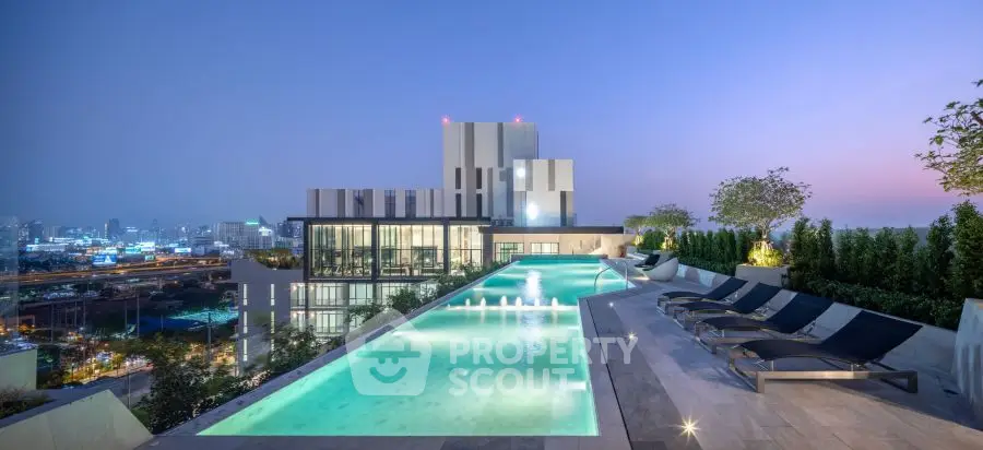 Luxurious rooftop pool with stunning city skyline views at sunset, perfect for relaxation and entertainment.