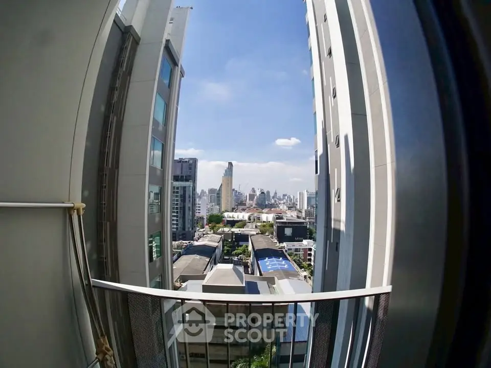 Stunning cityscape view from a modern high-rise balcony, perfect for urban living enthusiasts.