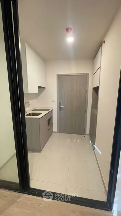 Compact modern kitchen with sleek cabinetry and minimalist design