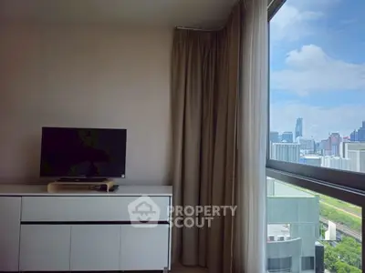 Modern living room with city view and sleek TV setup
