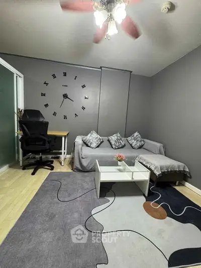 Modern living room with stylish decor and cozy seating area, perfect for relaxation and productivity.