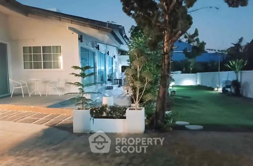 Charming suburban home with spacious garden and modern patio, perfect for outdoor relaxation and entertaining.