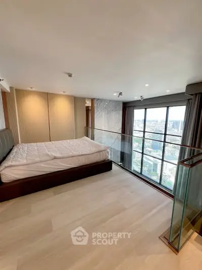 Luxurious bedroom with stunning city view and modern glass railing