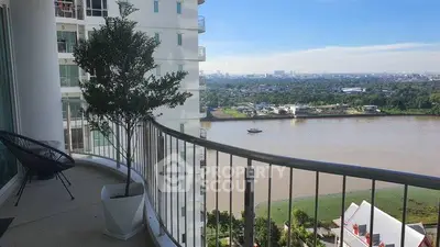 Stunning balcony with river view in modern high-rise apartment.
