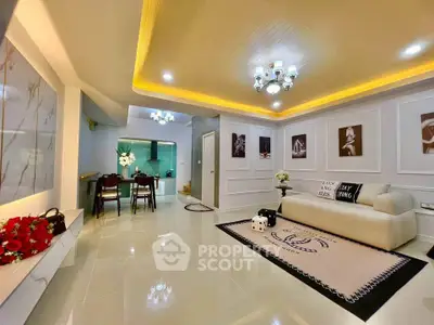 Stylish modern living room with elegant lighting and chic decor, perfect for contemporary living.
