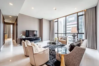 Luxurious modern living room with city view, elegant furniture, and large windows.