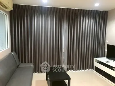 Modern living room with sleek curtains and minimalist furniture design.