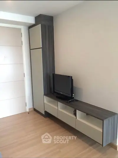 Modern living room with sleek TV unit and minimalist design