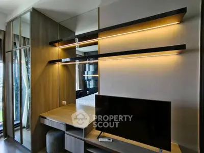 Modern living room with sleek TV unit and ambient lighting