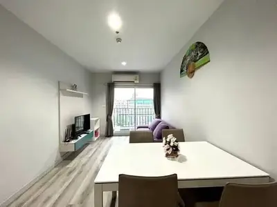 Modern living room with sleek furniture and natural light, ideal for urban living.