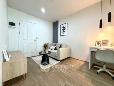 Modern living room with cozy sofa and stylish decor in a bright apartment.