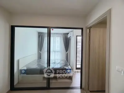 Modern bedroom with mirrored closet doors and natural light