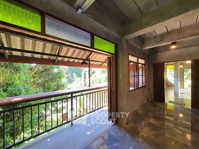 Charming balcony with lush green view and modern design elements