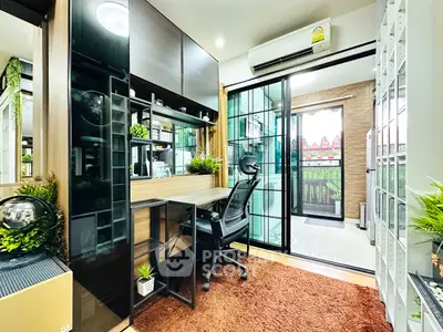 Modern study room with balcony view, featuring sleek desk and ergonomic chair, perfect for productivity.