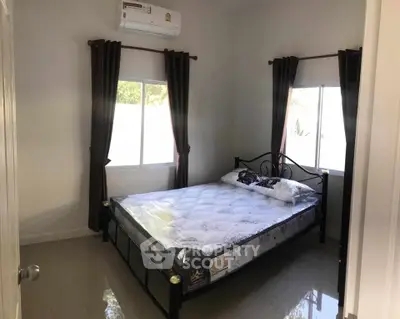 Cozy bedroom with natural light and modern decor