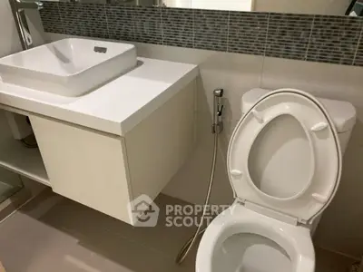 Modern bathroom with sleek fixtures and stylish tile backsplash