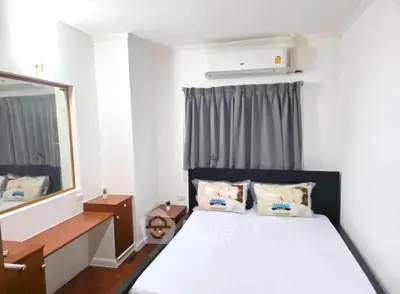 Cozy bedroom with air conditioning and elegant decor, perfect for relaxation.