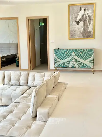Luxurious living room with modern decor and plush seating