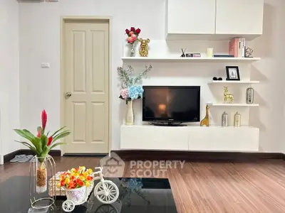 Stylish living room with modern decor and sleek wooden flooring